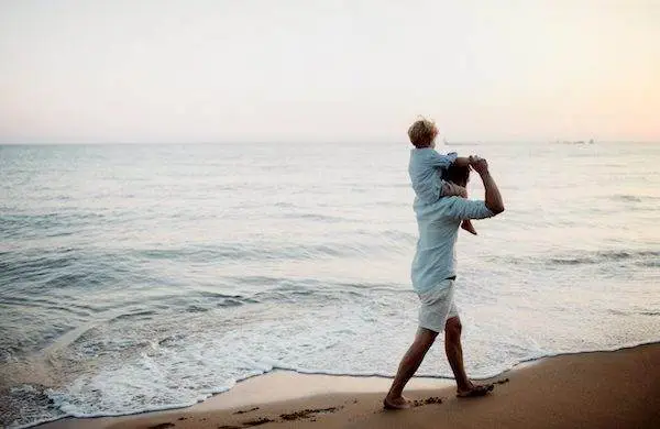 father-with-a-toddler-boy-walking-on-beach-on-summ-2022-02-08-22-39-29-utc-scaled (1)