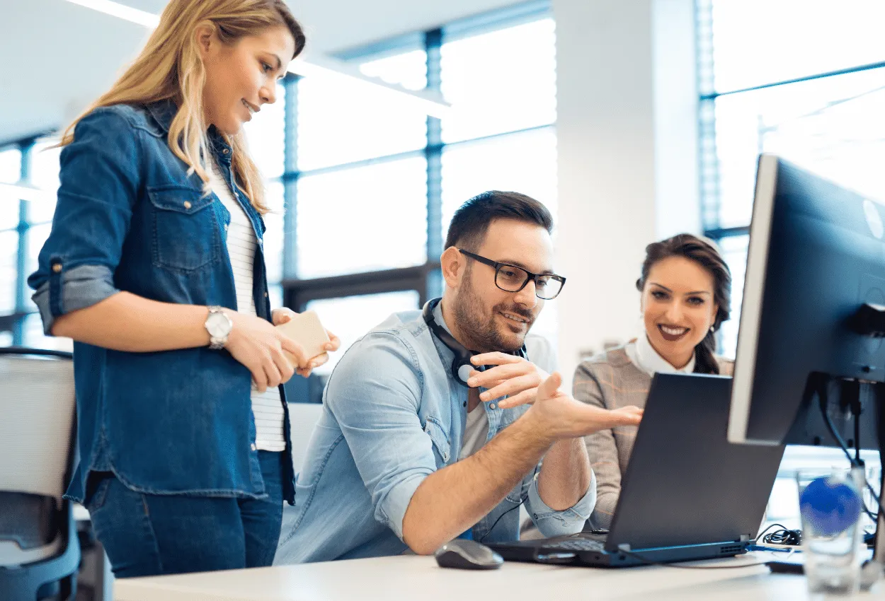 Team collaborating on outsourcing strategies in a modern office